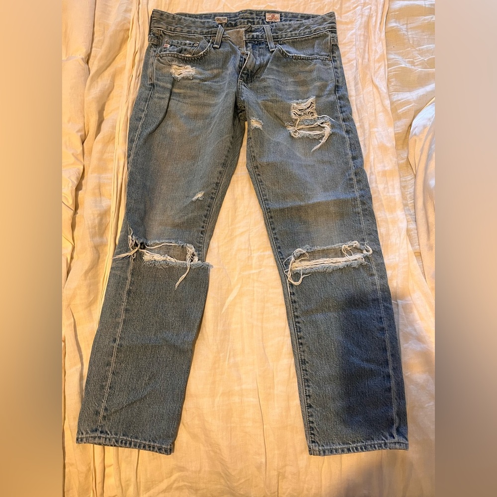 Light blue heavily distressed boyfriend denim jeans